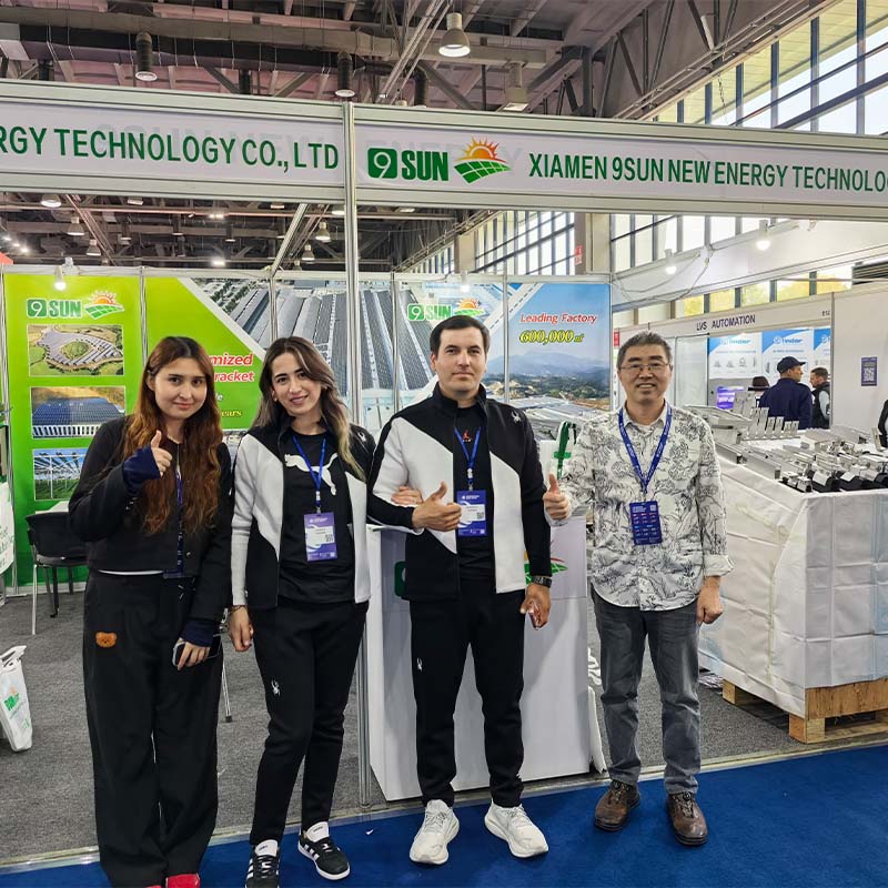 Project agreement photo with a Central Asian client at the 9SUN exhibition stand